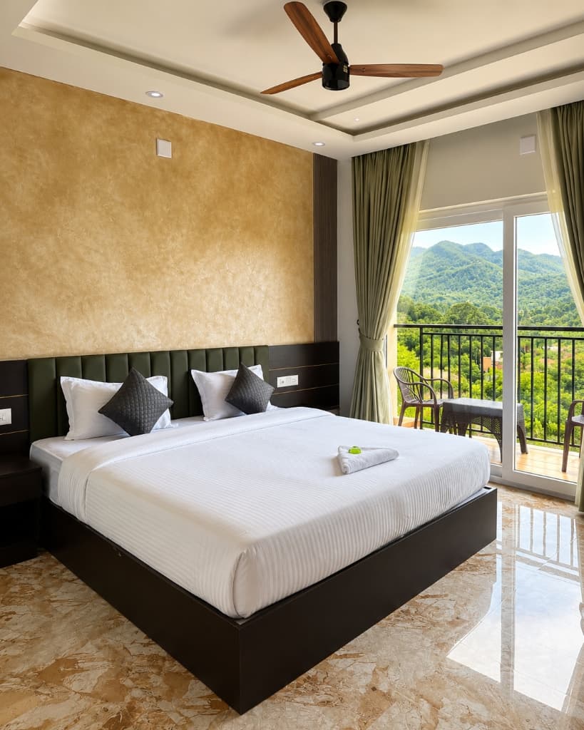 Luxury room with panoramic mountain view from private balcony