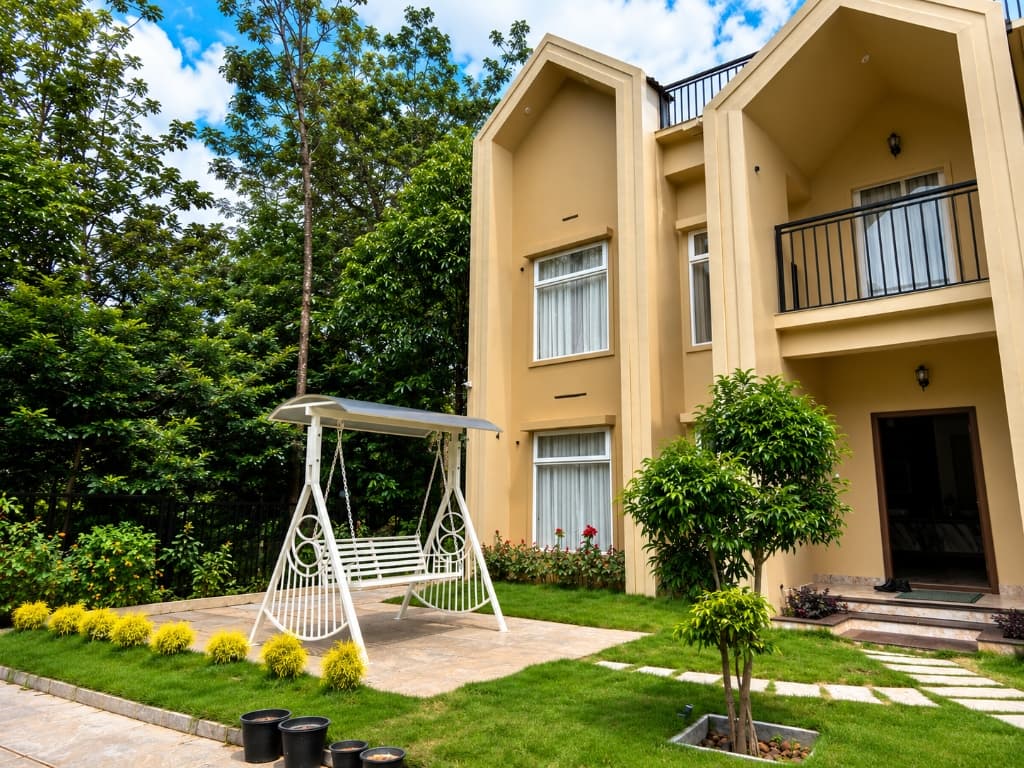 Resort garden with decorative swing and lush landscaping